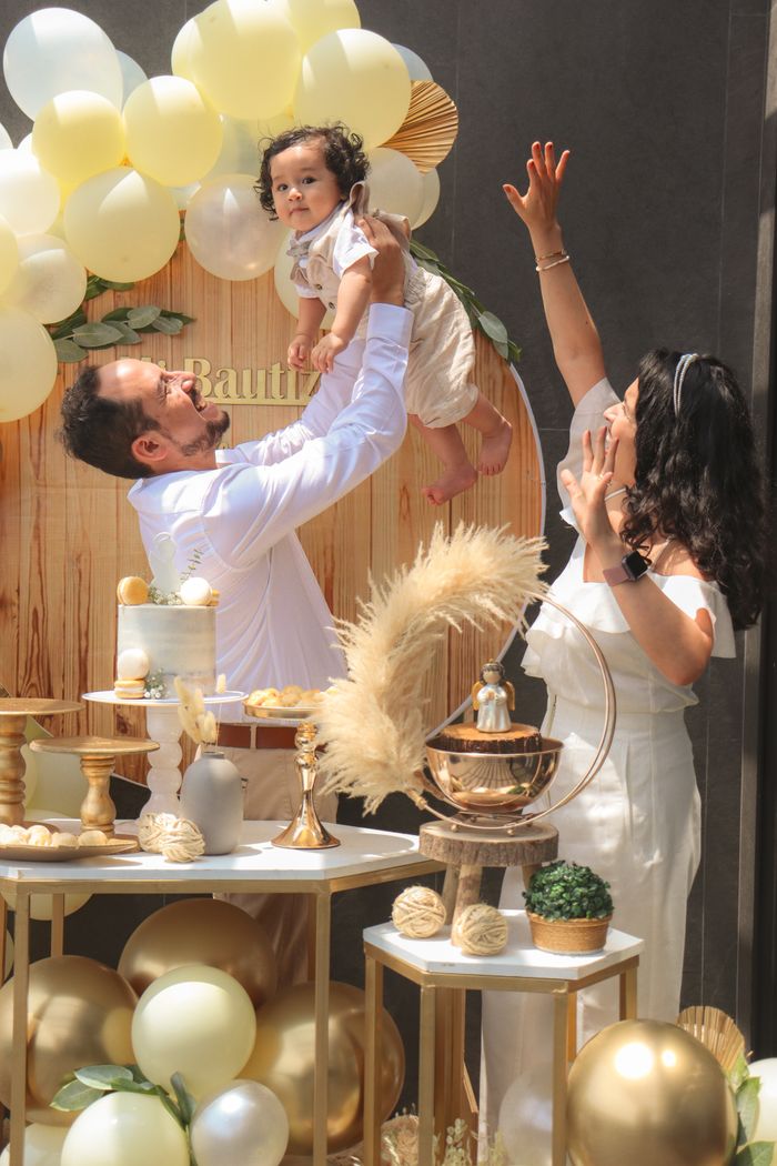 The Art of Drawing Readers In: Your attractive post title goes here Joyful family celebration with balloons, cake, and festive decor featuring parents and baby.
