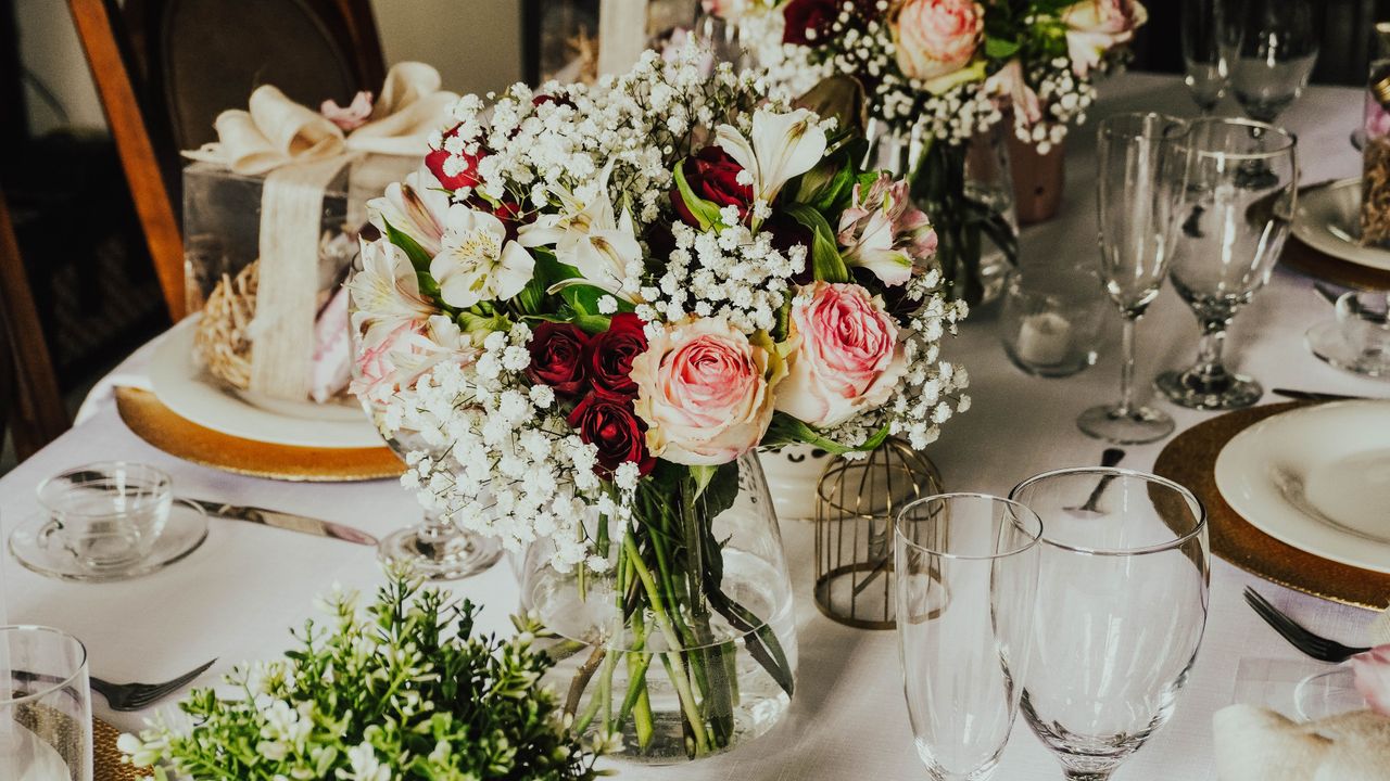 Crafting Captivating Headlines: Your awesome post title goes here An elegant table setting featuring a vibrant bouquet of roses and delicate glassware, perfect for special occasions.