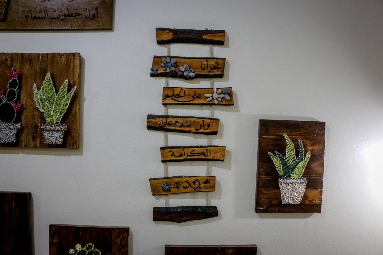about-us-01 Beautiful handcrafted wooden plaques with string art and Arabic script, perfect for home decor.